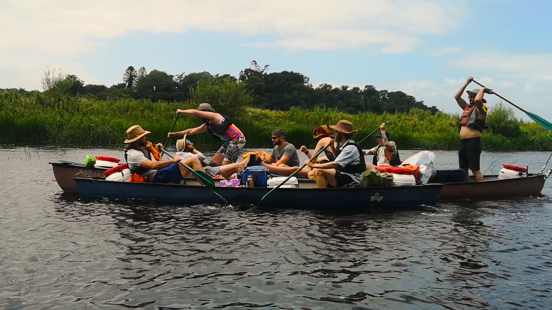 Group of people enjoy a Paddle Your Own Canoe trip on the river Barrow.
